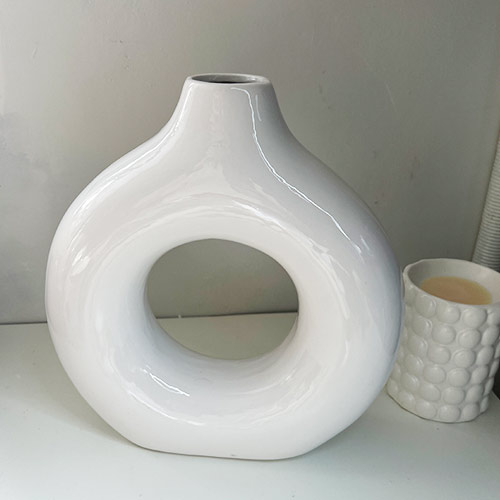 Glossy white donut vase